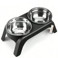 Stainless steel double-dish pet feeder with black base on a white background